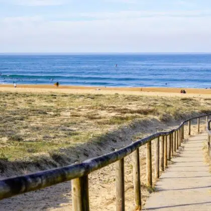 Plus beaux villages à découvrir autour des Sables d’Olonne 14 access ocean sandy pathway fence wooden to ocean beach atlantic sea coast at talmont saint hilaire vendee France